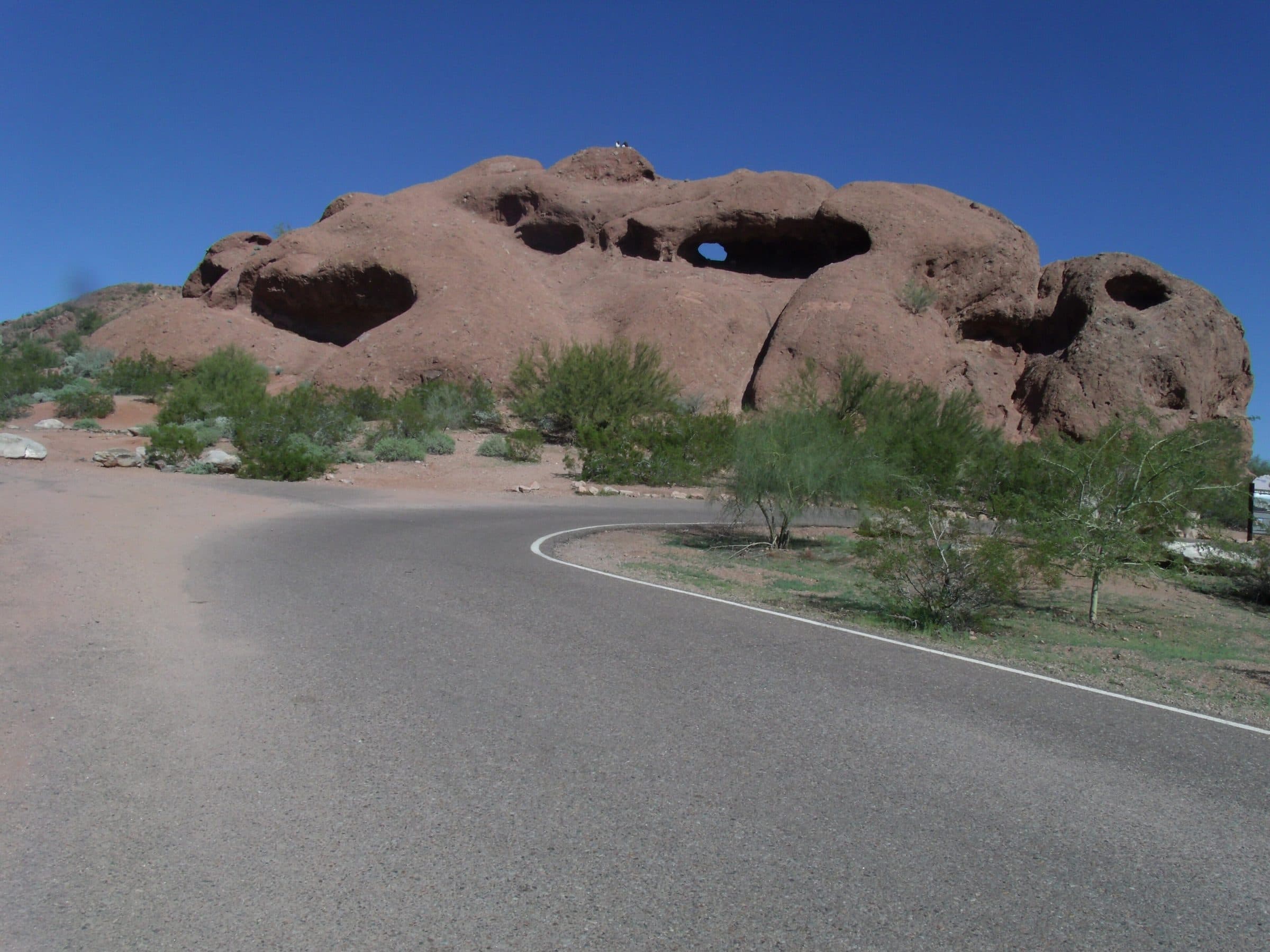 The red sandstone butte of Hole-in-the-Rock in Papago Park, with the hole near its top