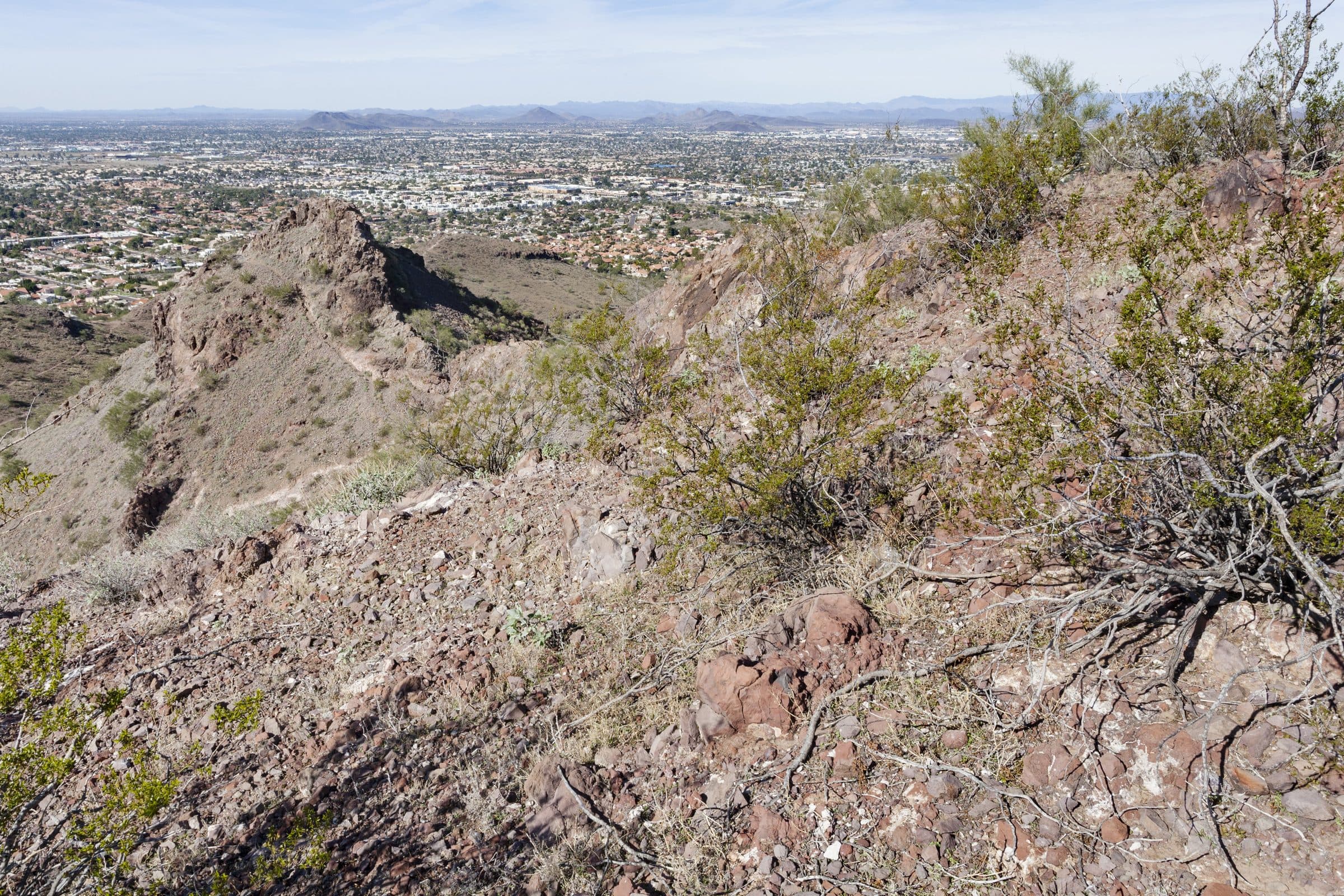 Rocky, shrubby slopes on Lookout Mountain with north Phoenix stretching to the horizon