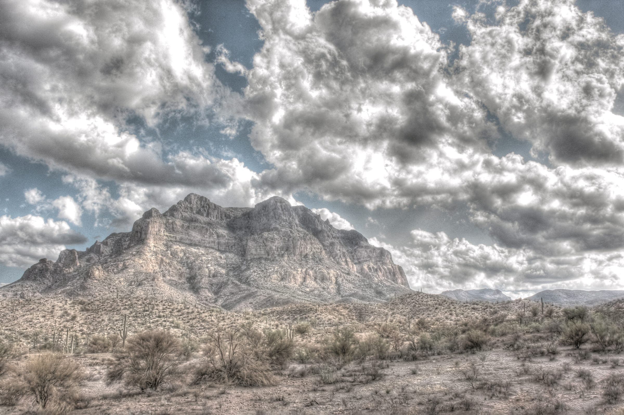 Picketpost Mountain's cliff-ringed summit rising above desert scrub near Superior